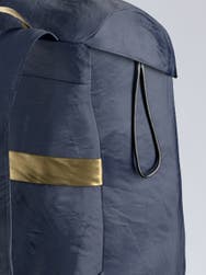 A zoomed in shot of a navy away packable backpack.