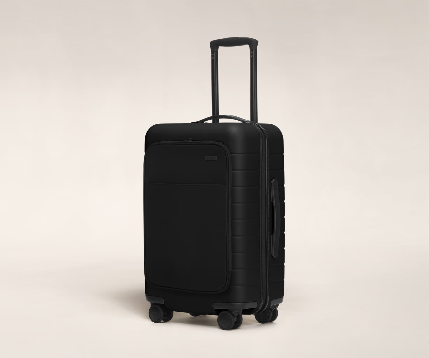 The Carry-On with Pocket in Black shown at an angle with raised telescoping handle