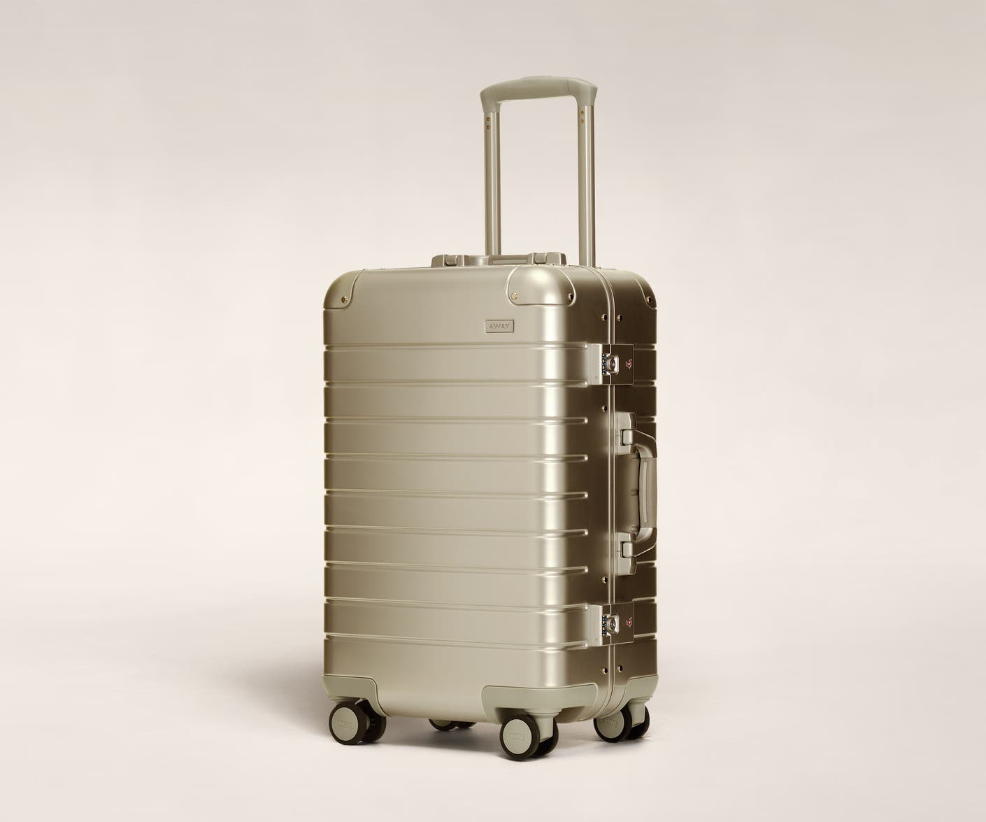 Aluminum luggage The Bigger Carry-On suitcase in Gold