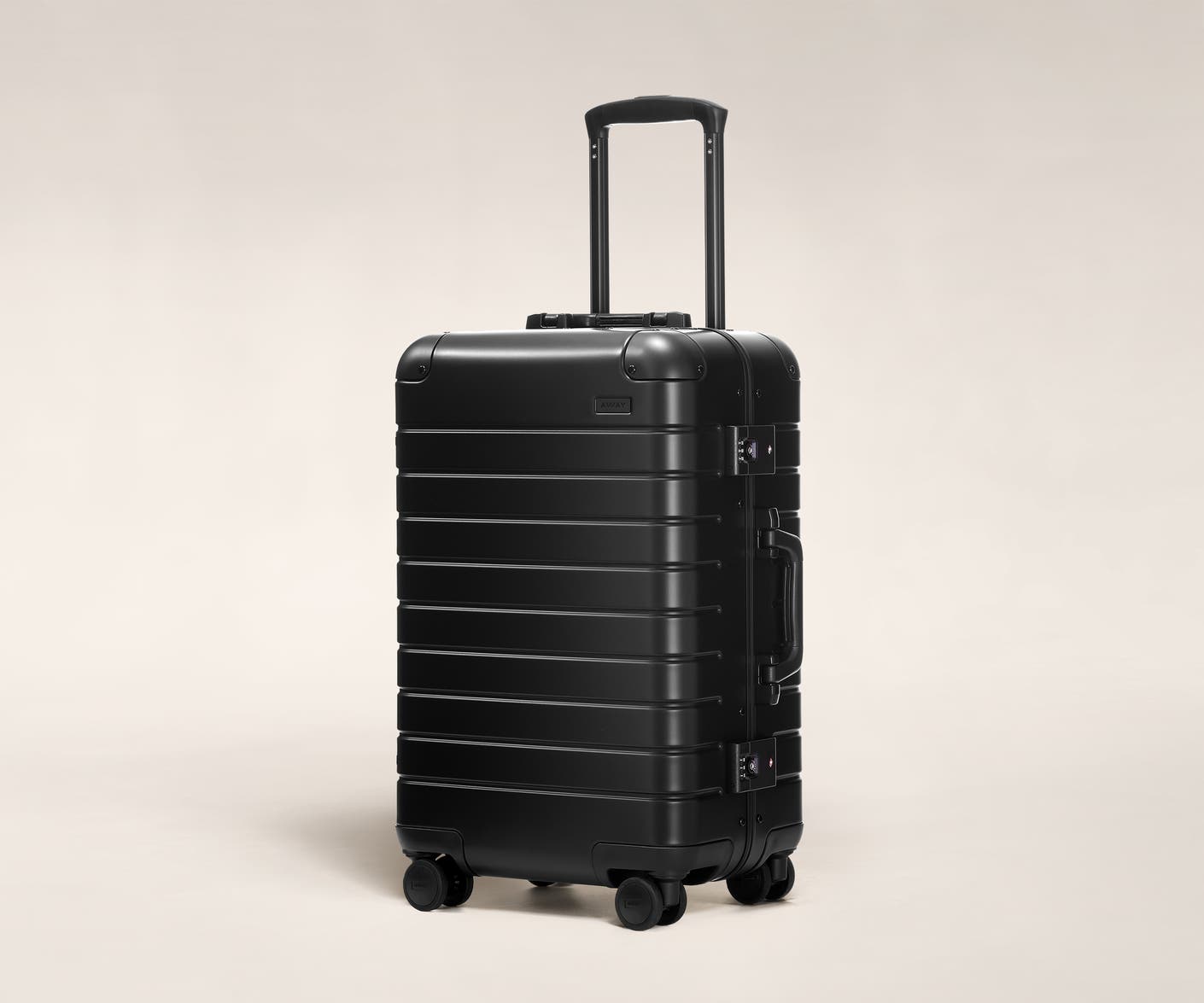 Aluminum luggage The Bigger Carry-On suitcase in Onyx Black