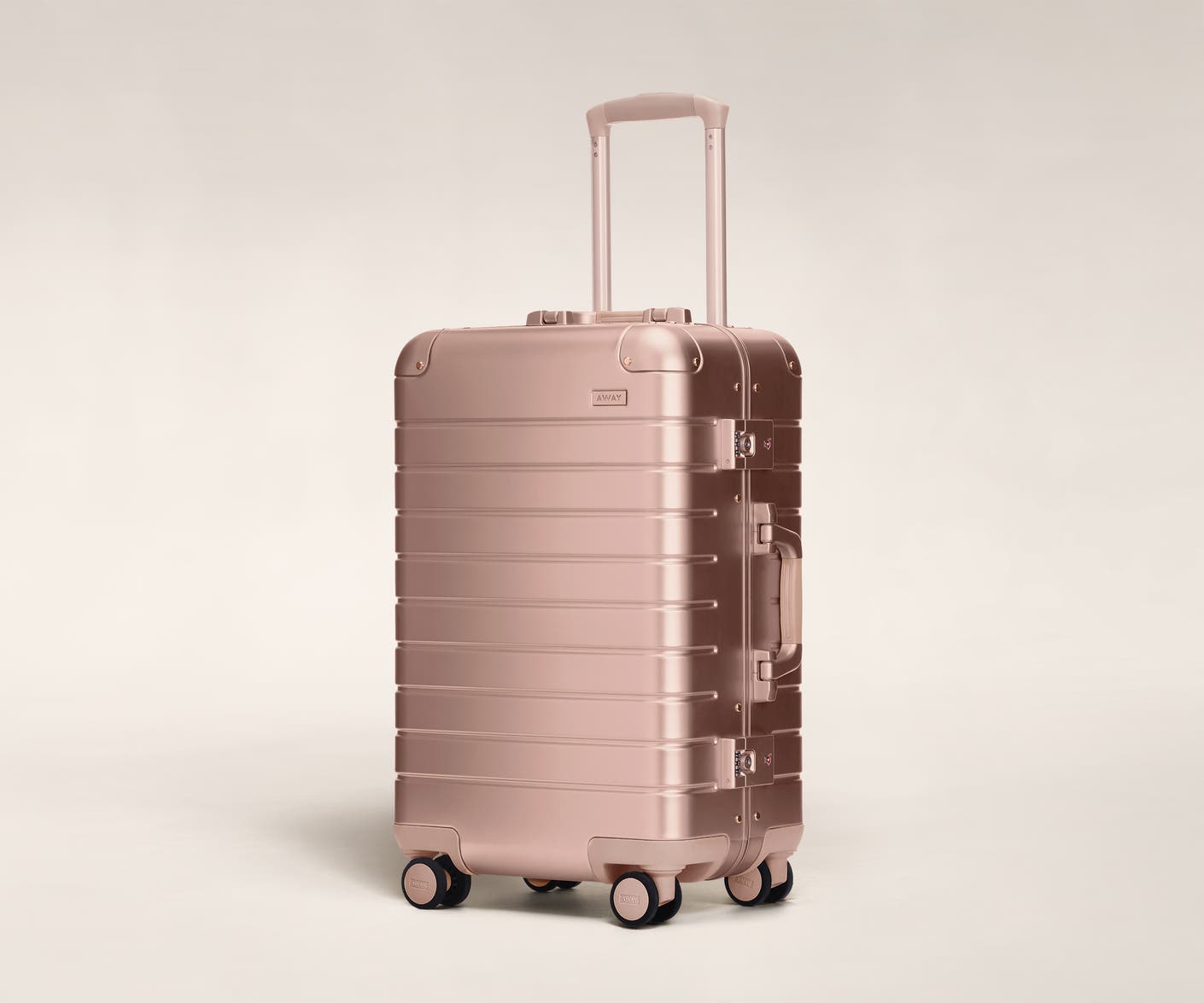 Aluminum luggage The Bigger Carry-On suitcase in rose gold