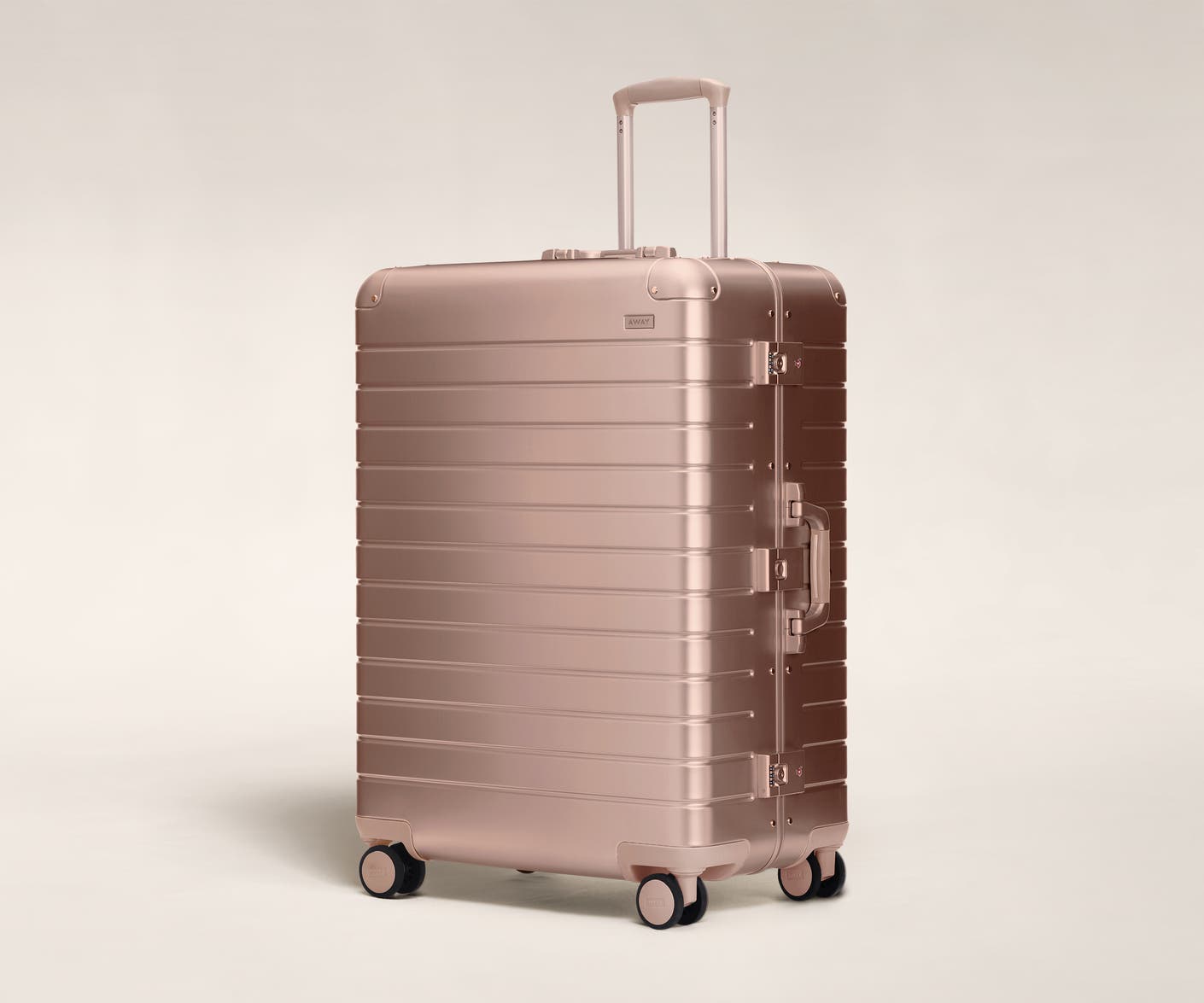 Aluminum checked luggage The Large suitcase in rose gold