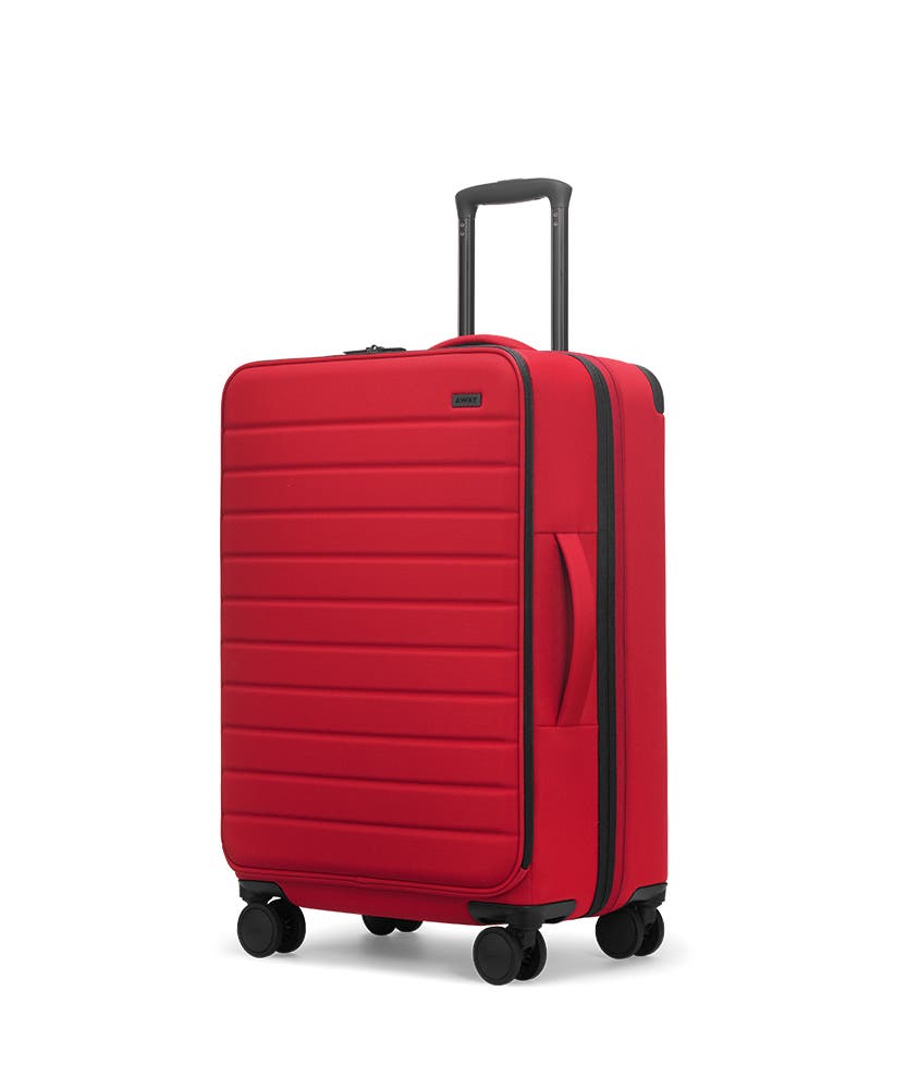 Red soft-sided Medium with raised telescopic handles shown at an angle.