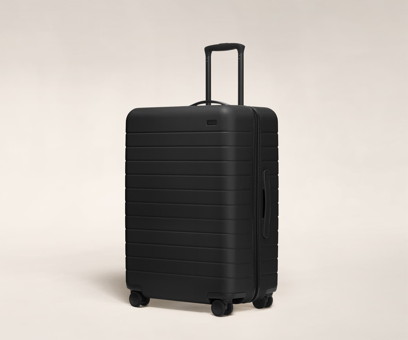 The Medium in Black shown at an angle with raised telescoping handle
