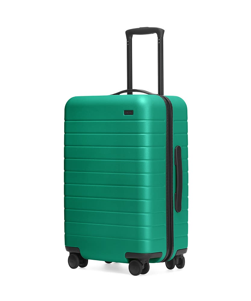The Sea-green Bigger Carry-On hardside with raised telescopic handles shown at an angle.