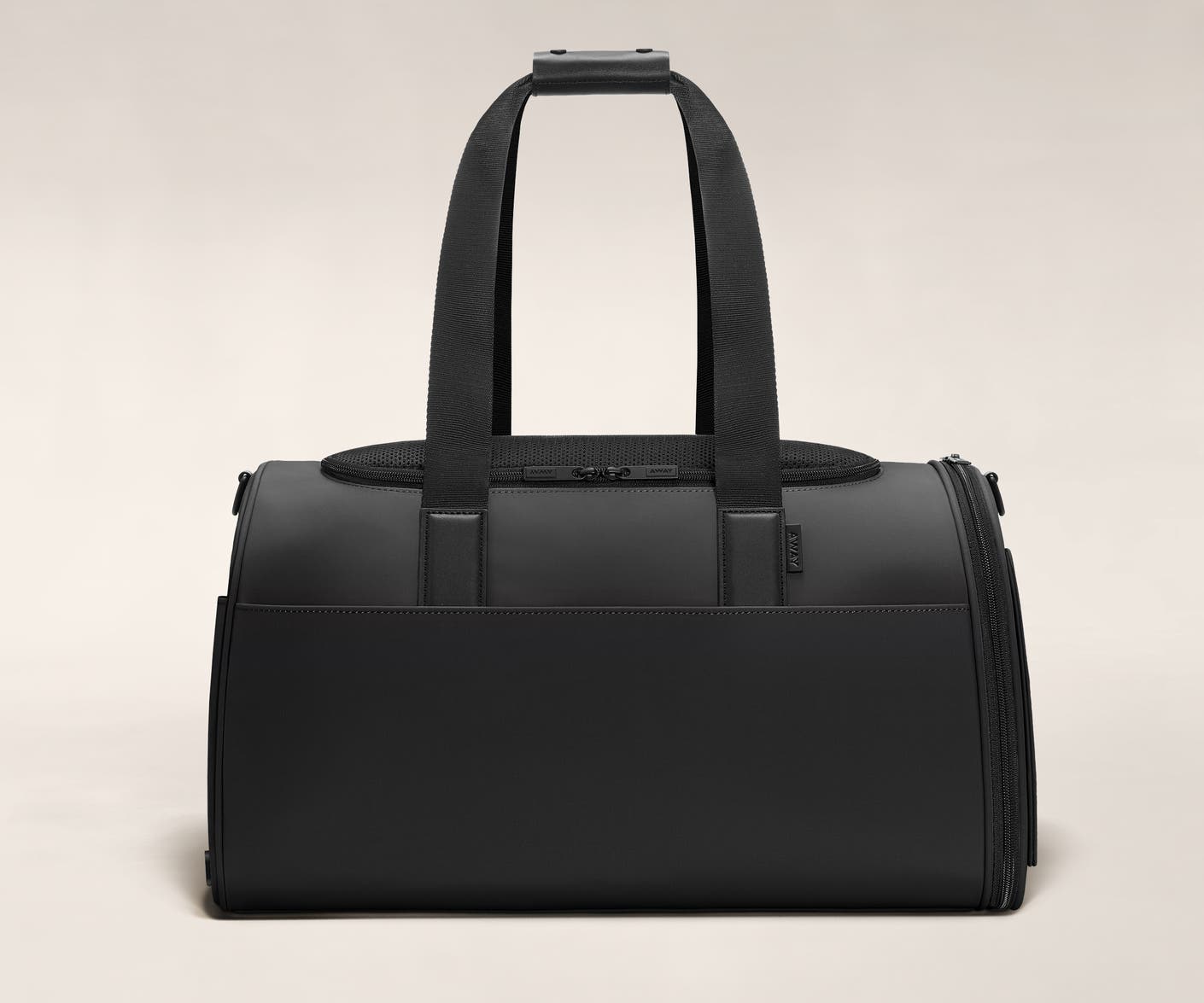 A black color pet carrier with black trim.