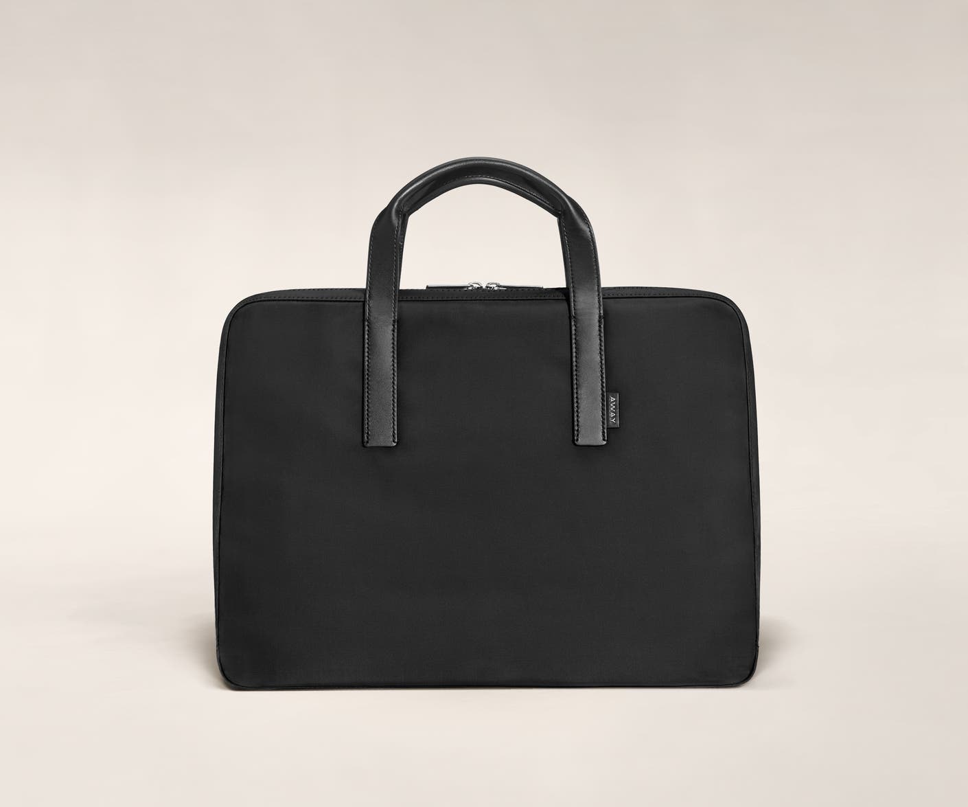 Black laptop bag with raised handles in leather trim