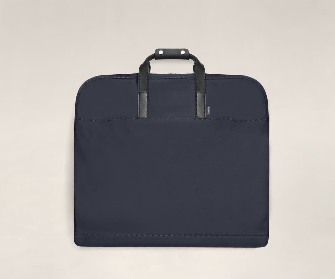navy garment bag folded view with leather trim handles.