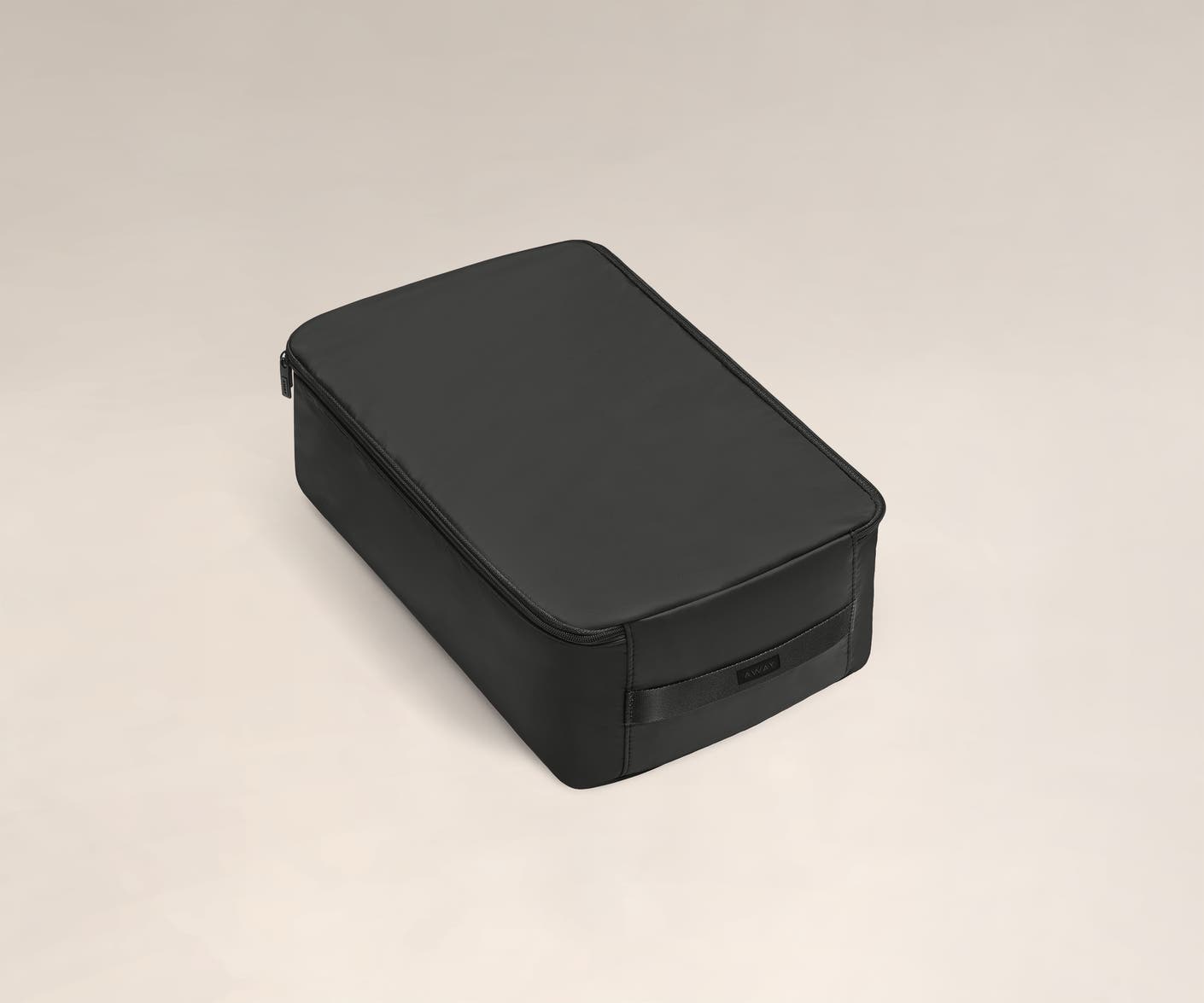 A large black shoe cube