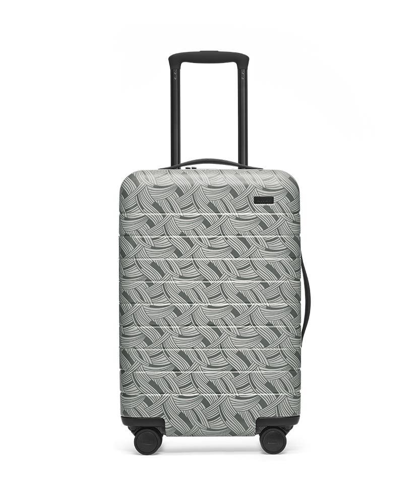 Front view of the Away Light Swirl Carry-On hardside showing raised handle.