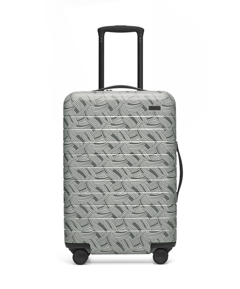 Front view of the Away Light Swirl Bigger Carry-On hardside showing raised handle.