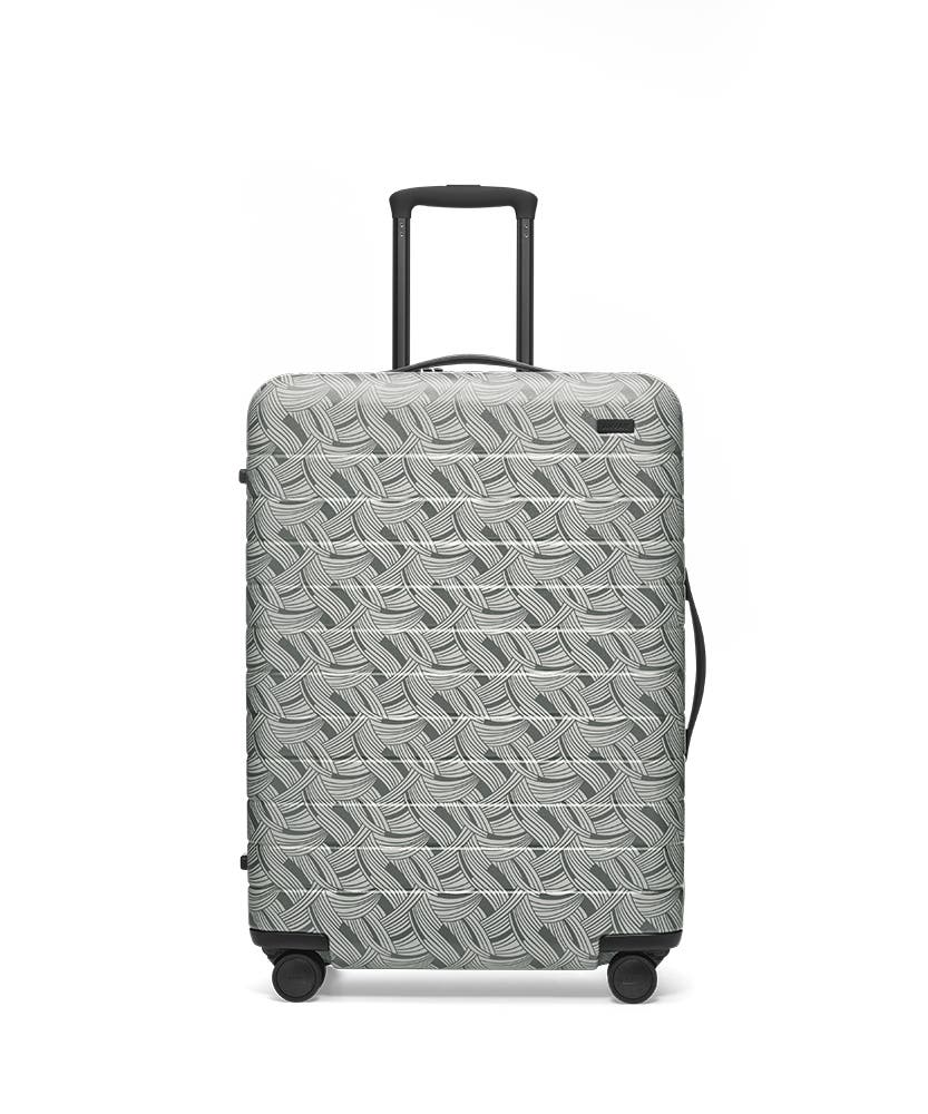 Front view of the Away Light Swirl Medium hardside showing raised handle.