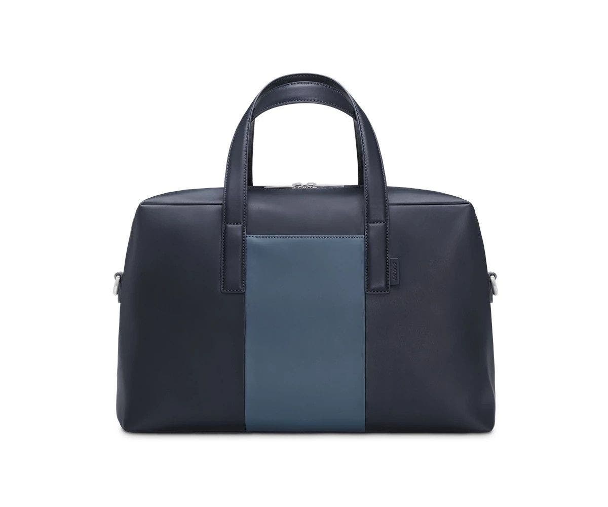 Front of a Coast/Navy duffle bag with raised straps.