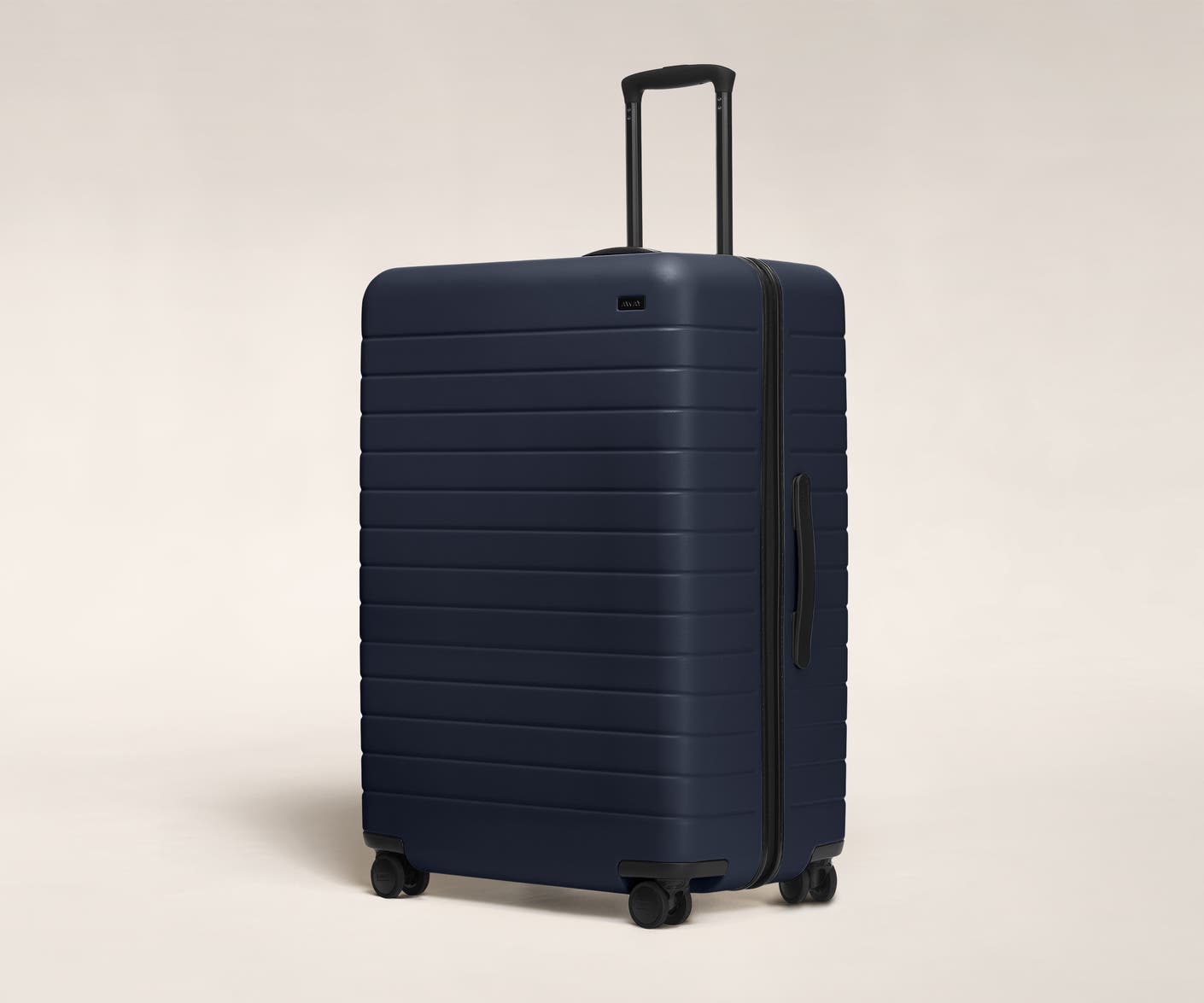 The Large in Navy shown at an angle with raised telescoping handle
