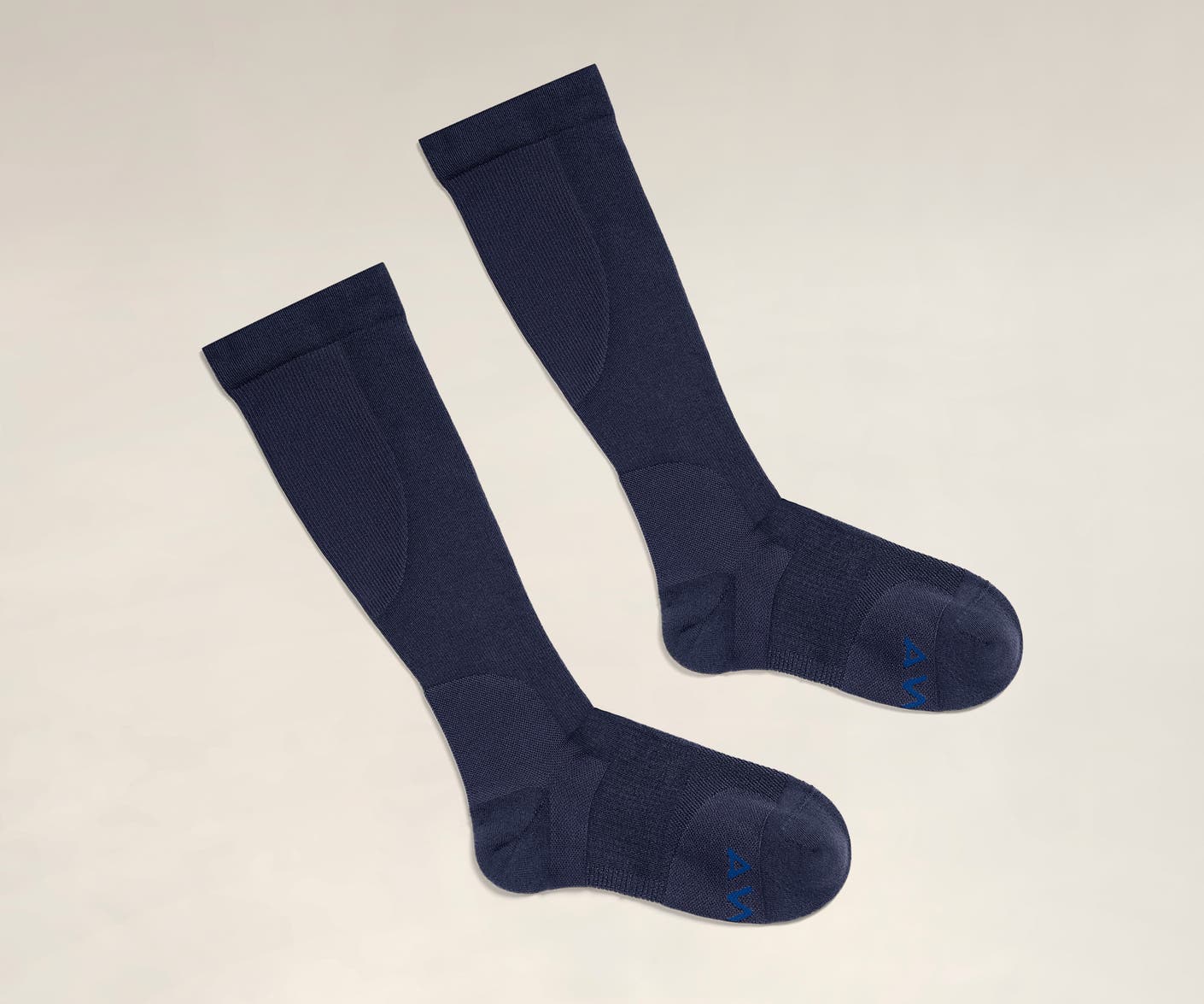 A pair of navy compression socks for travel comfort.