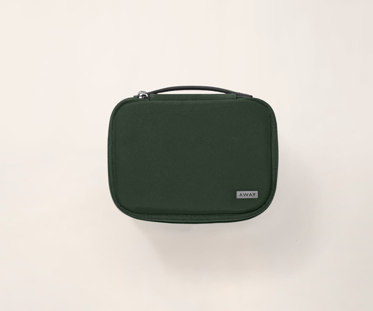 A travel tech organizer case from Away in green.