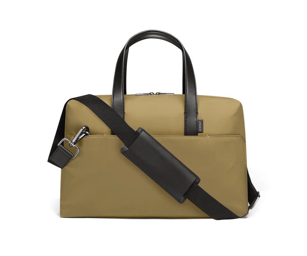 Olive duffle with back zip pocket, and shoulder strap across the bag.