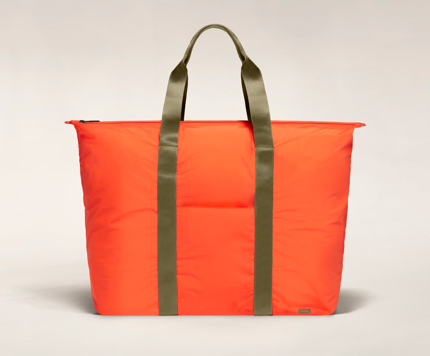 Front view of the Away packable carryall in the color cayenne.
