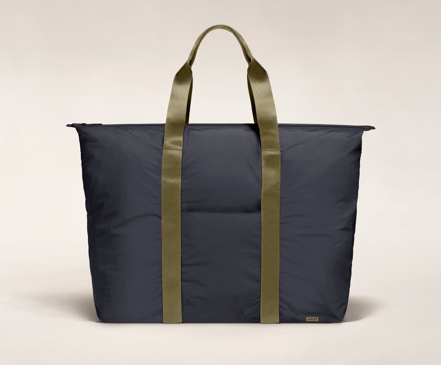Front view of the Away packable carryall in the color navy.