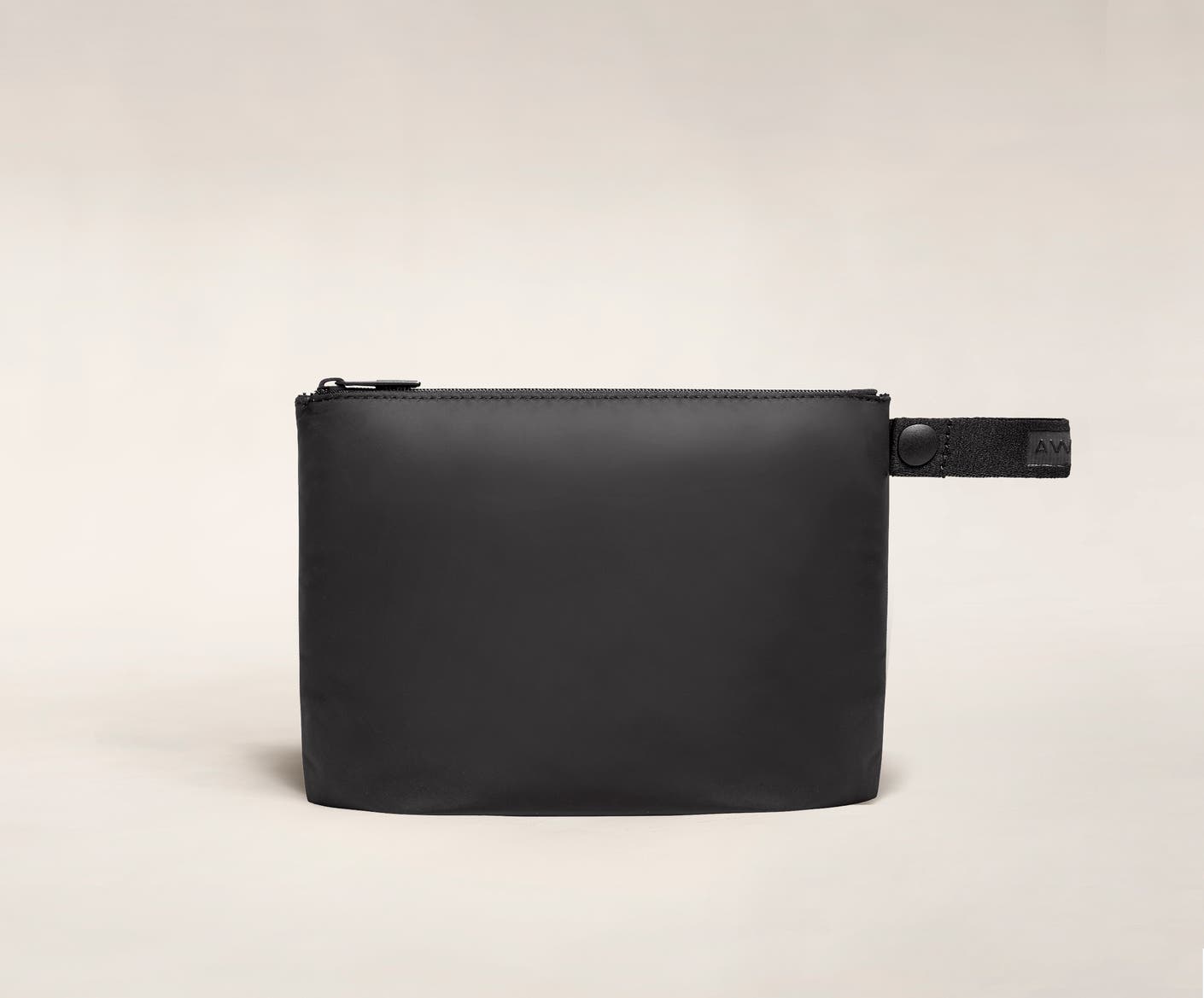 Front view of the Away small organizational travel pouch in the color black