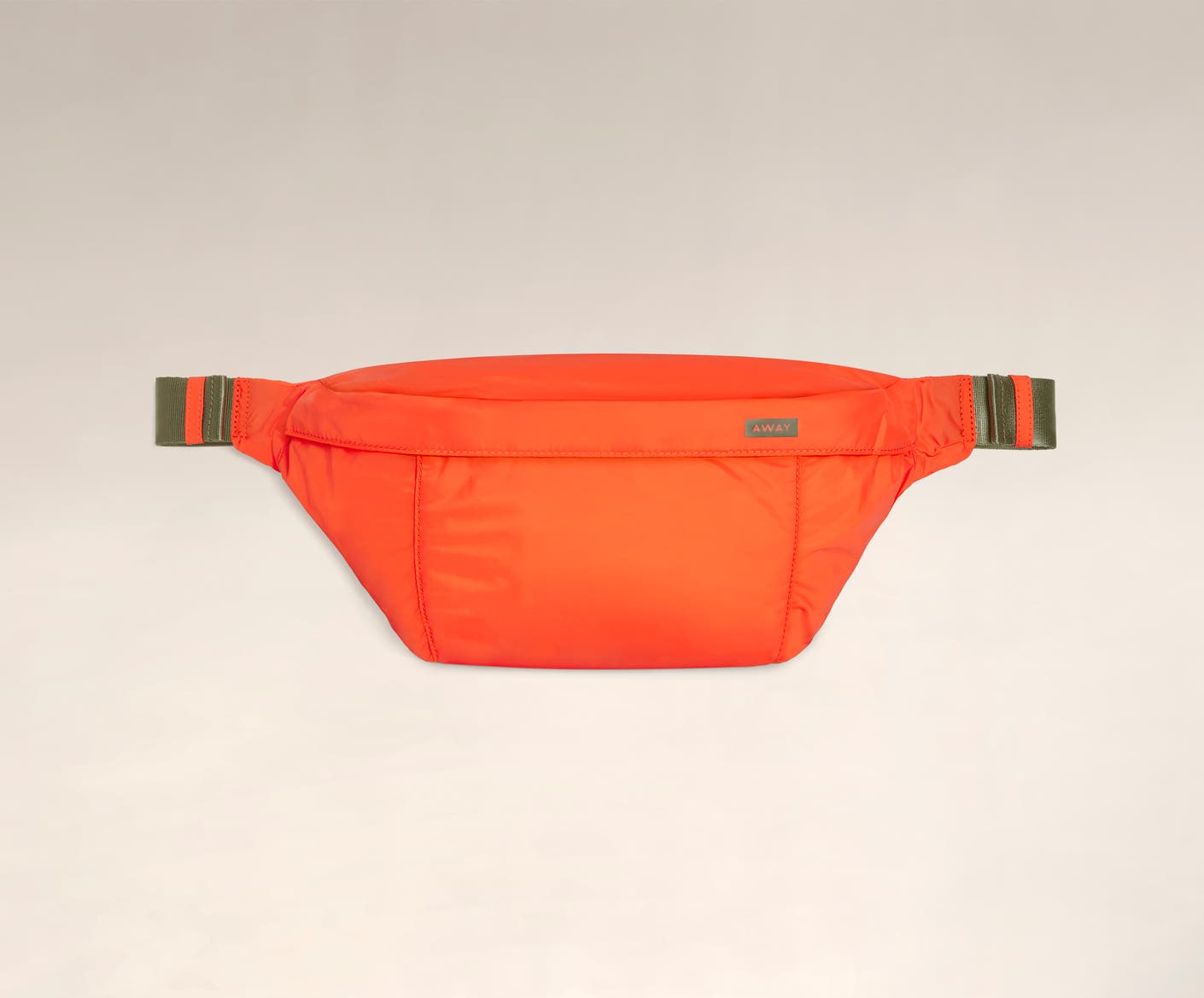 Front view of the Away packable sling bag in the color cayenne.