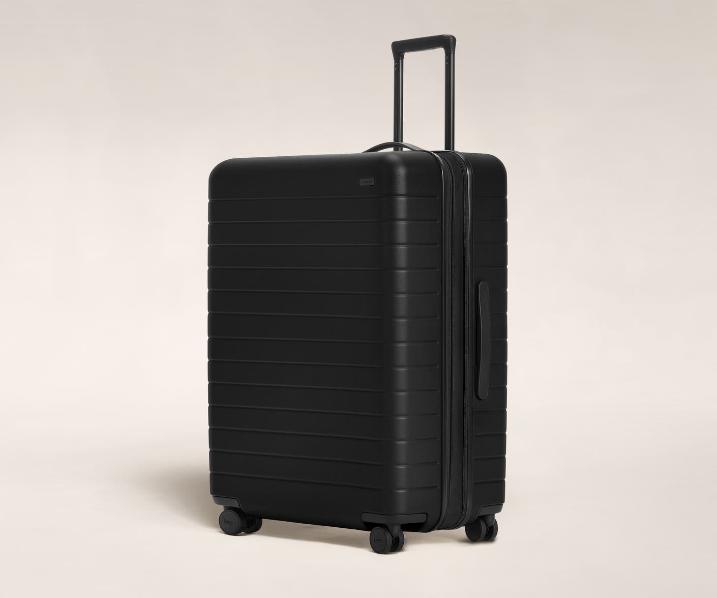 The Large Flex in Black shown at an angle with raised telescoping handle.