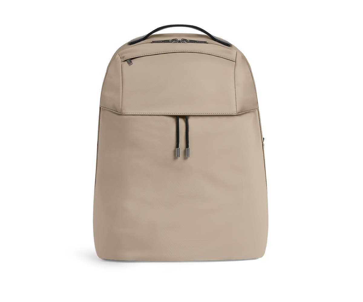 Front shot of sand backpack with a front flap pocket.