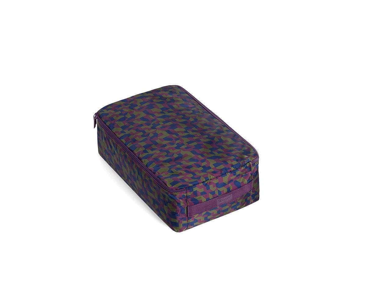 A angled view of a small geometric print shoe cube.
