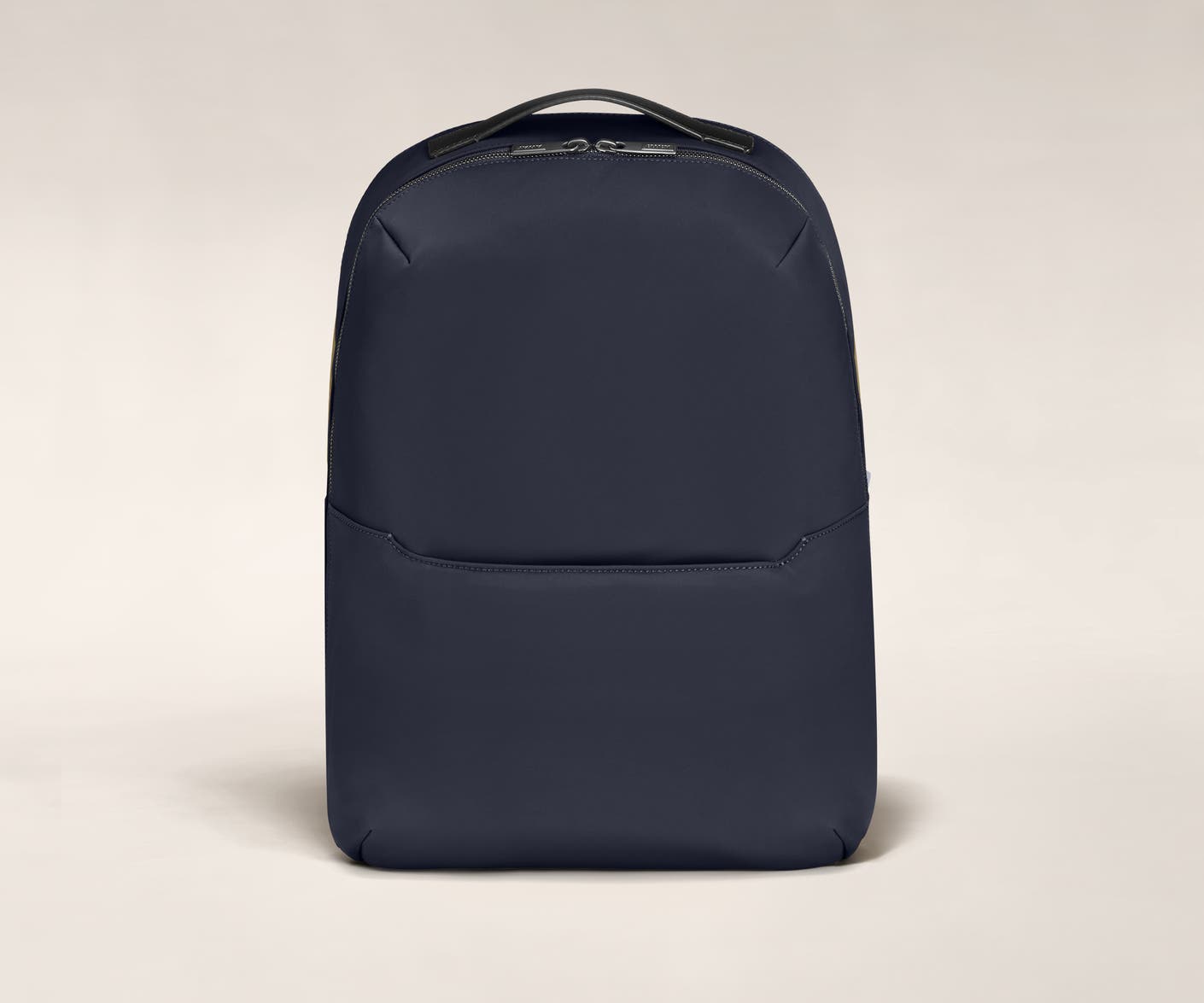 Backpack in Navy with one small pocket in the front.