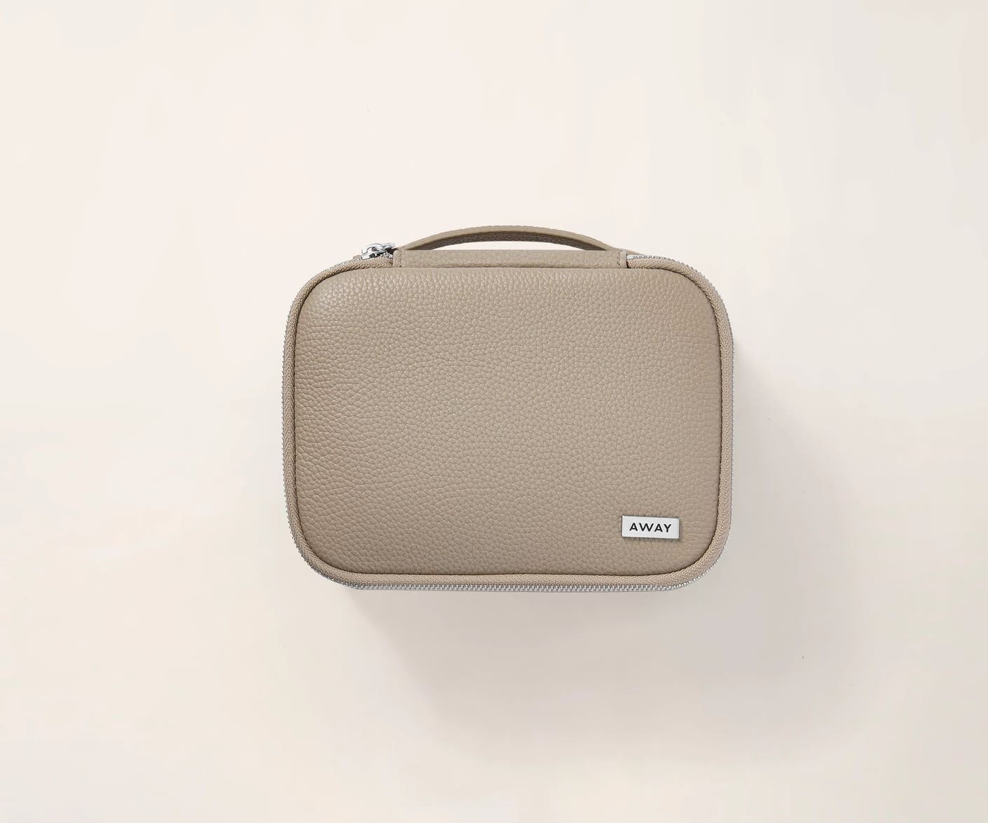 Top view of the Away tech case in limited edition Sand leather and canvas