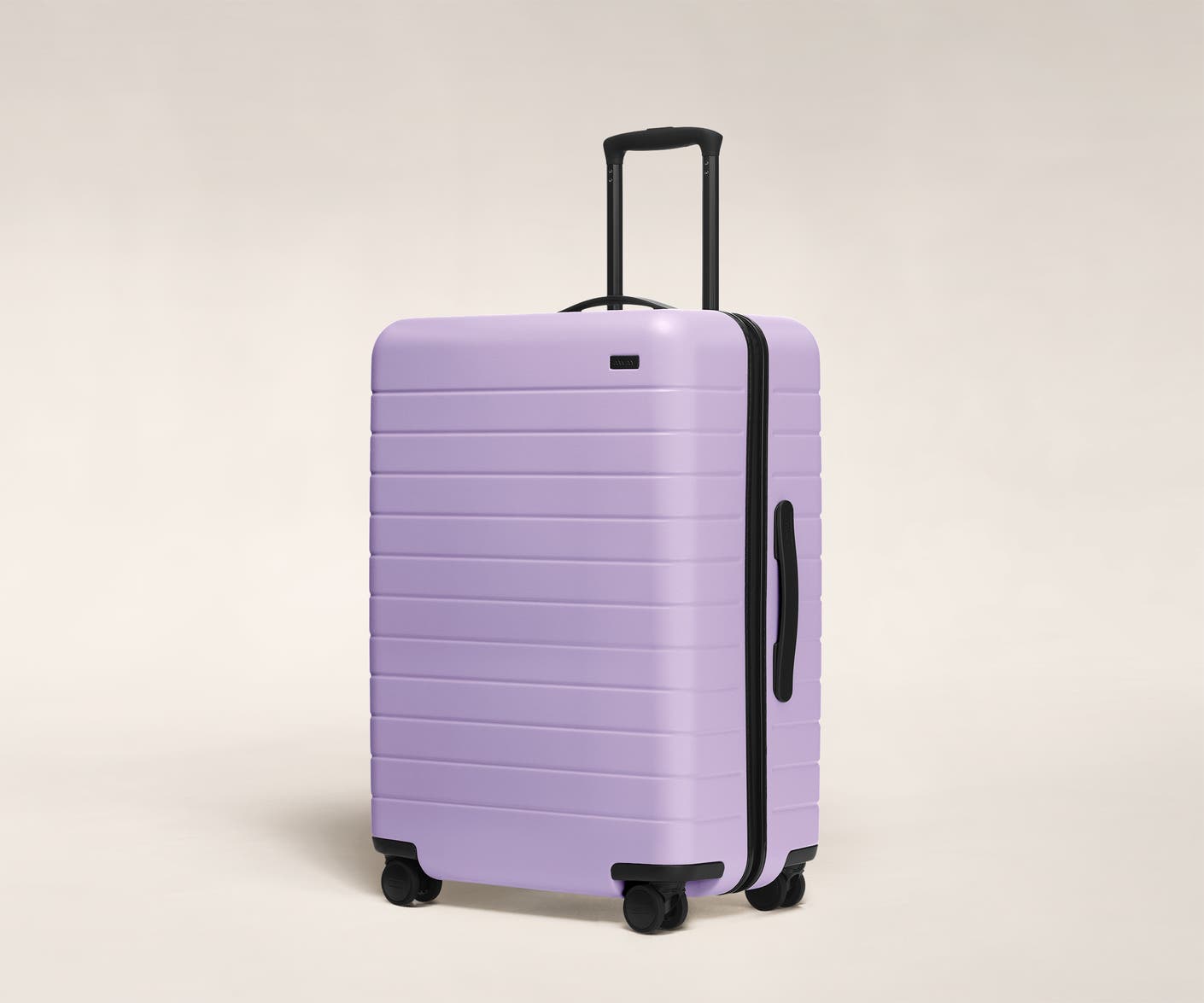 The Medium in Navy shown at an angle with raised telescoping handle