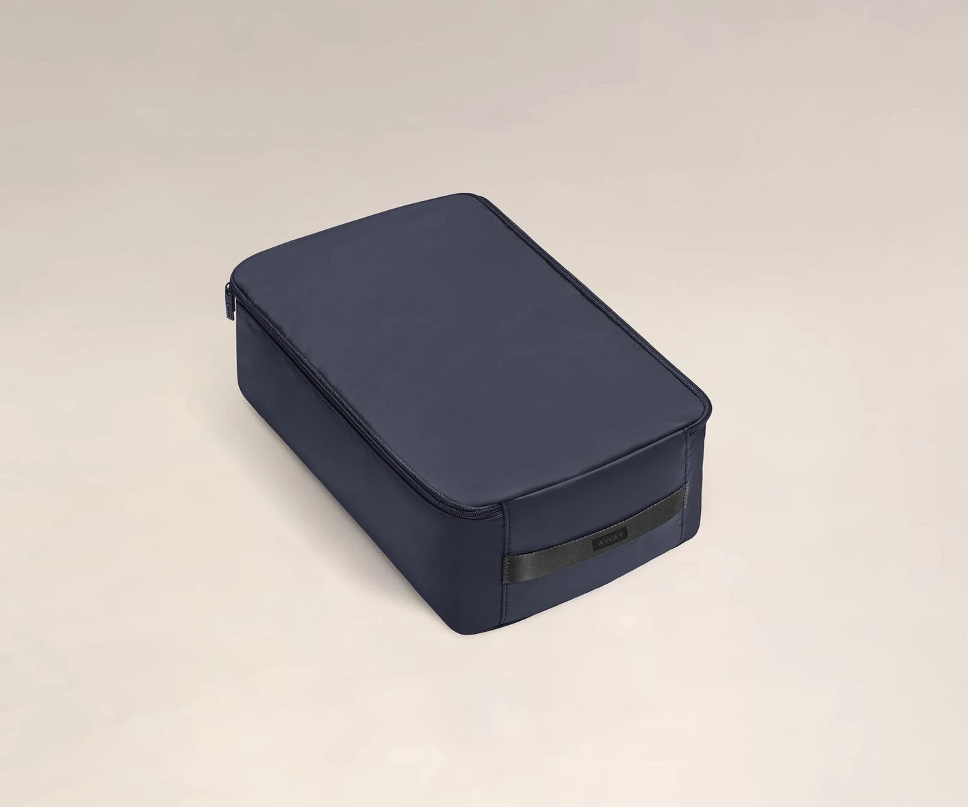 A large black shoe cube