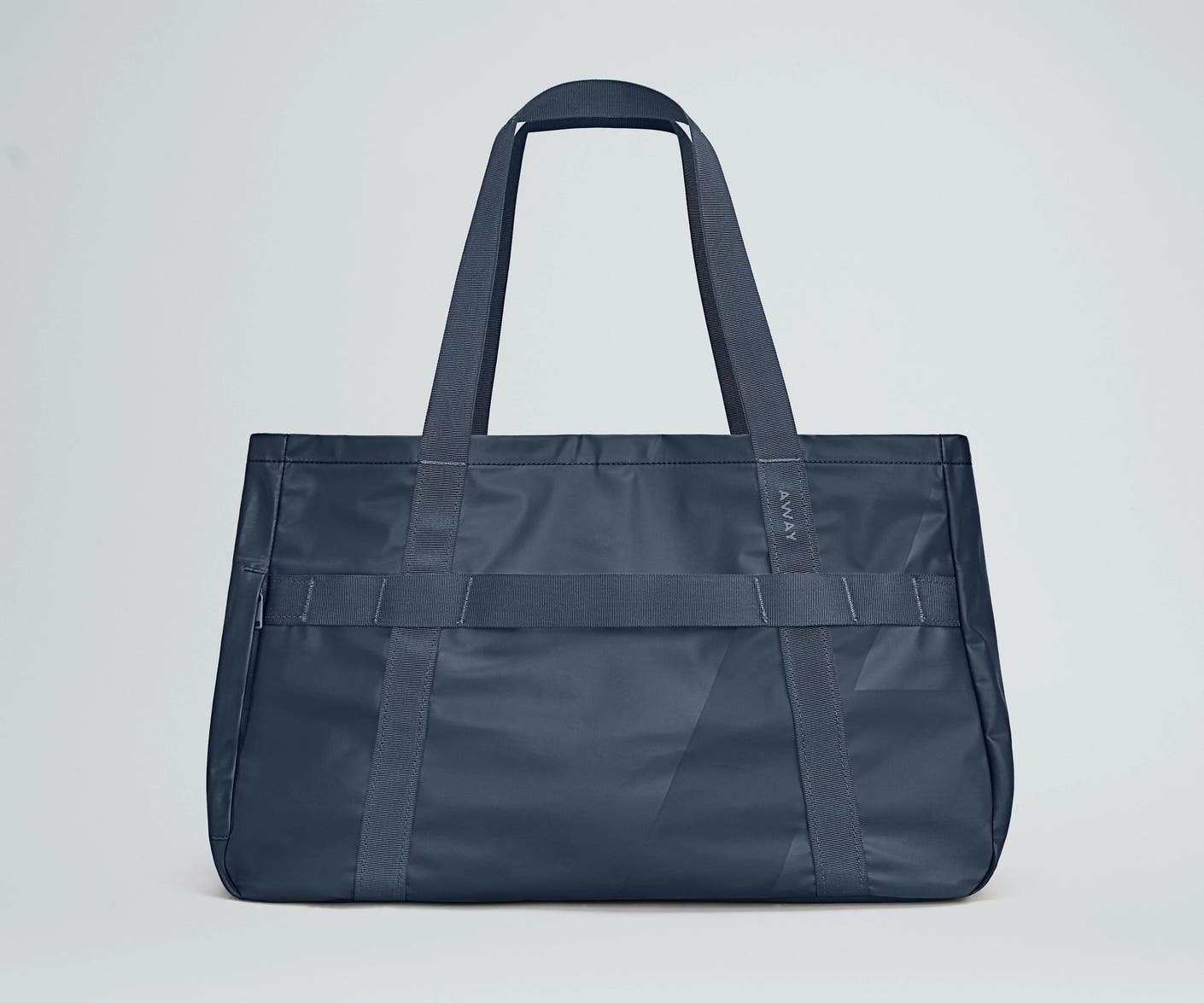 Front view of the Away For All Routes Tote 45 liters in navy