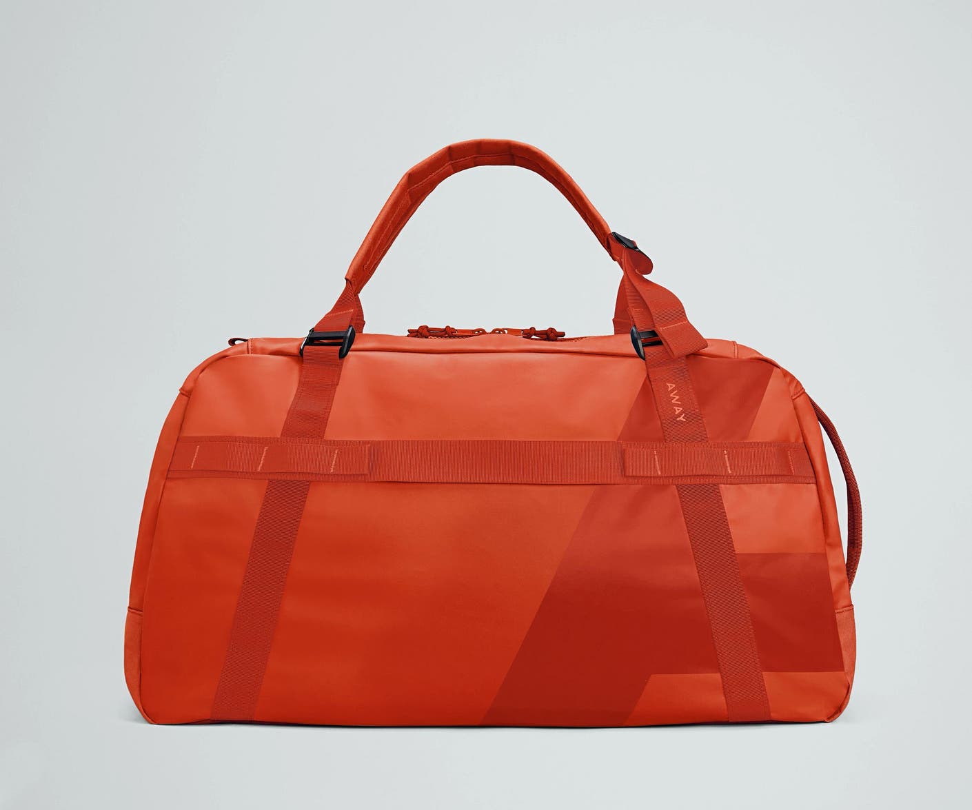 Front view of the Away For All Routes Duffle 55 Liters in red orange