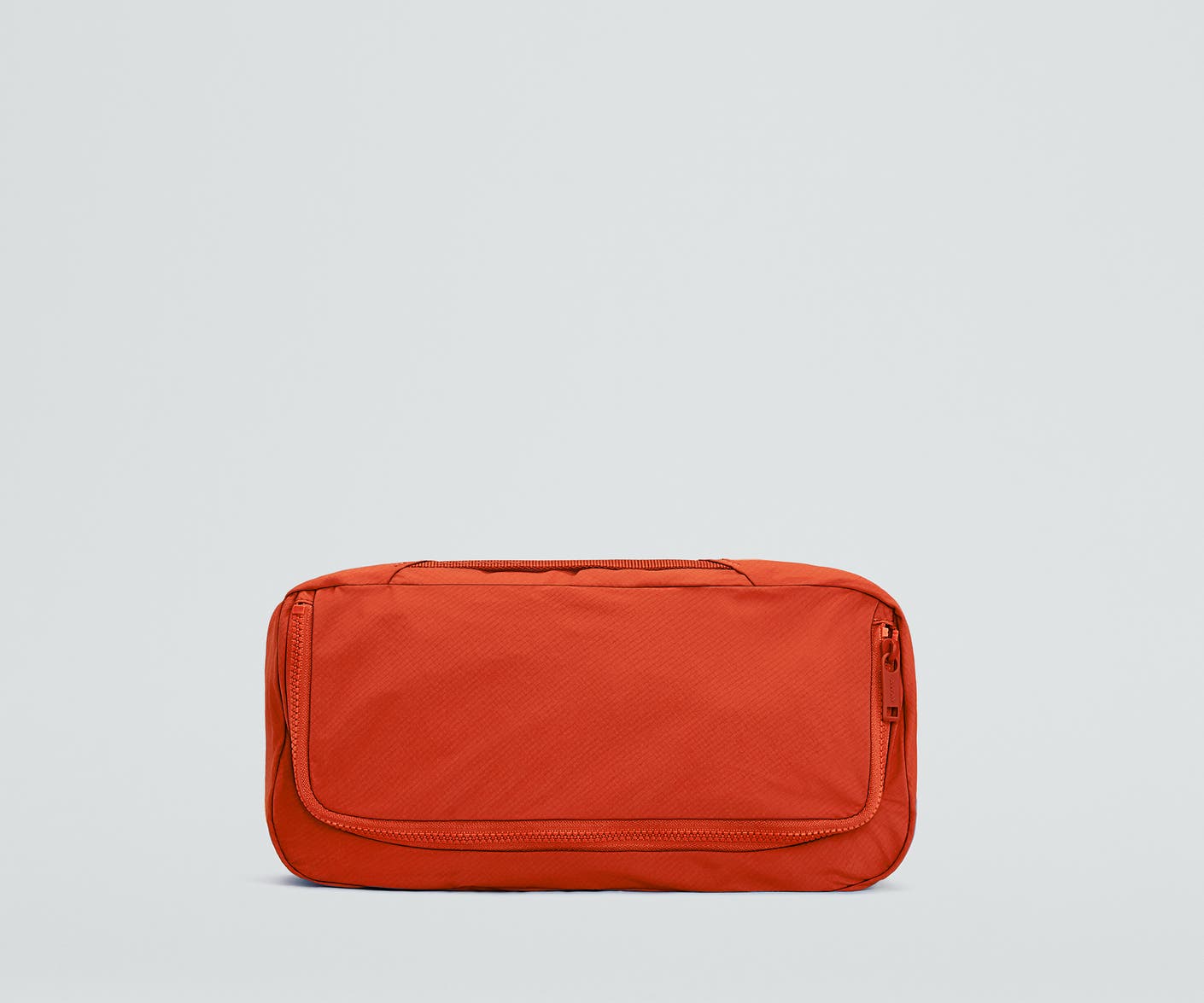 Front view of the For All Routes Small Organizational Cube in Red Orange