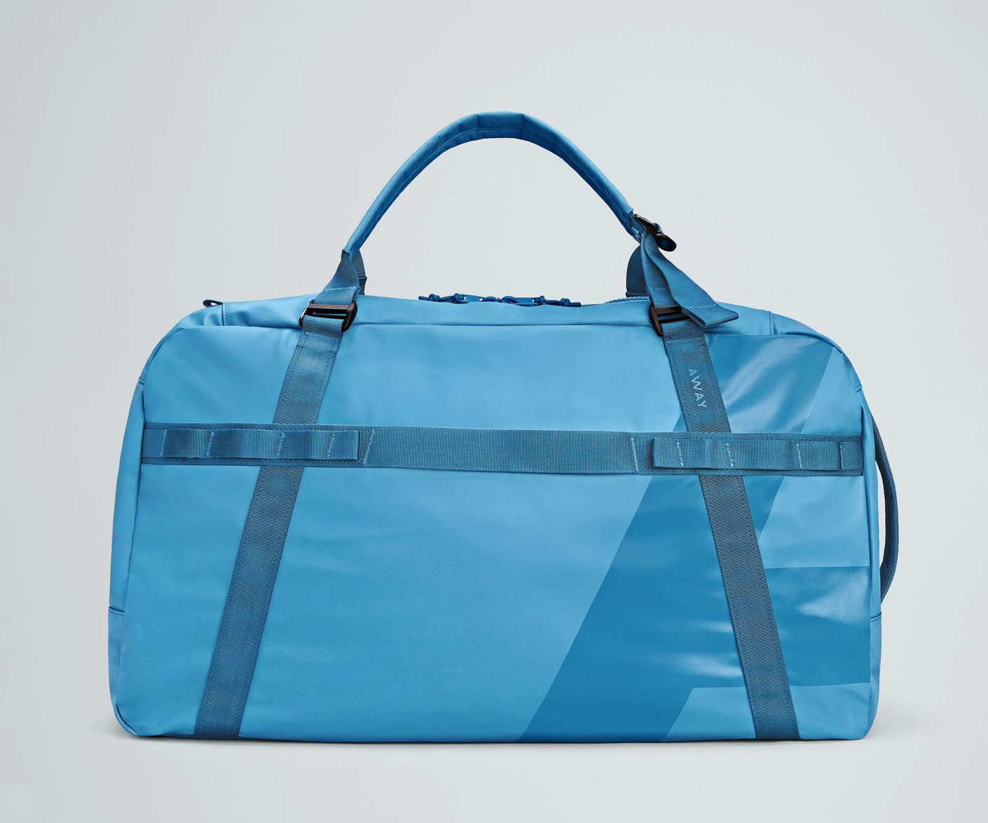 Front view of the Away For All Routes Duffle 70 Liters in bright blue