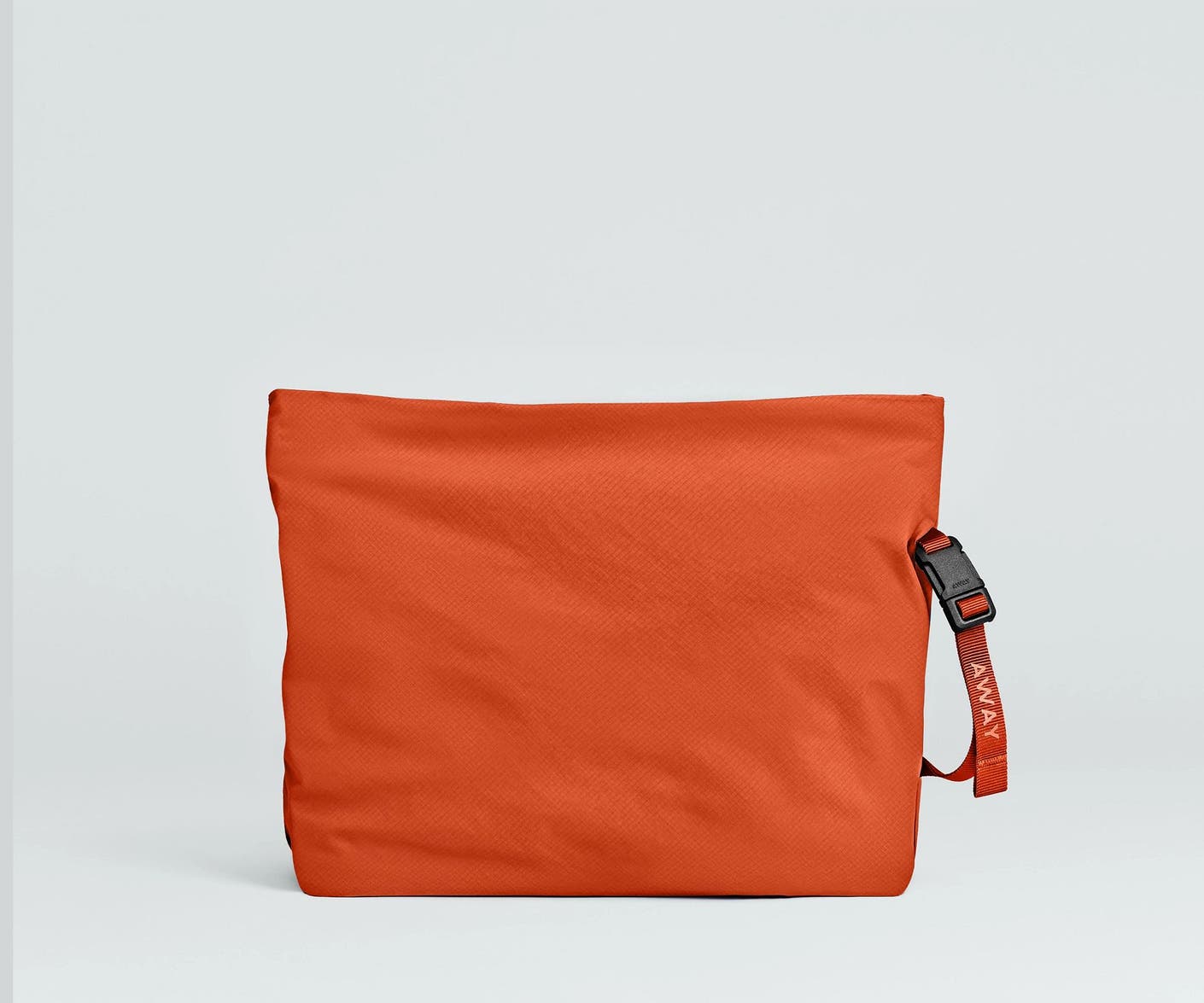 Front view of the Away For All Routes Large Pouch in red orange
