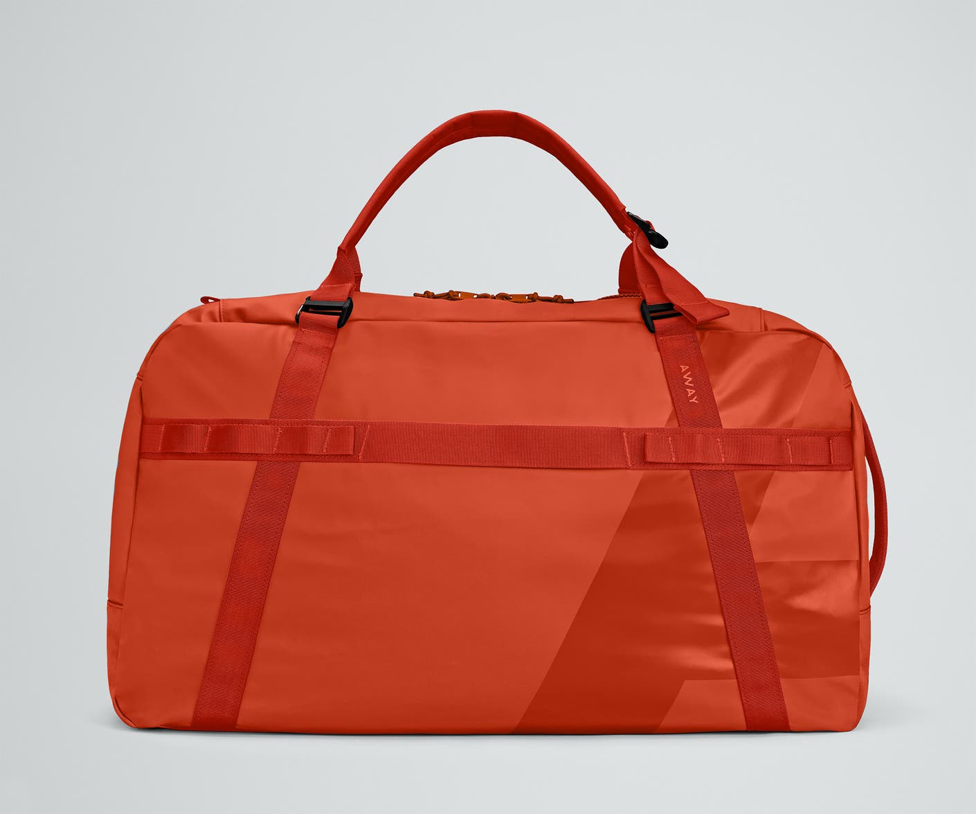 Front view of the Away For All Routes Duffle 70 Liters in red orange
