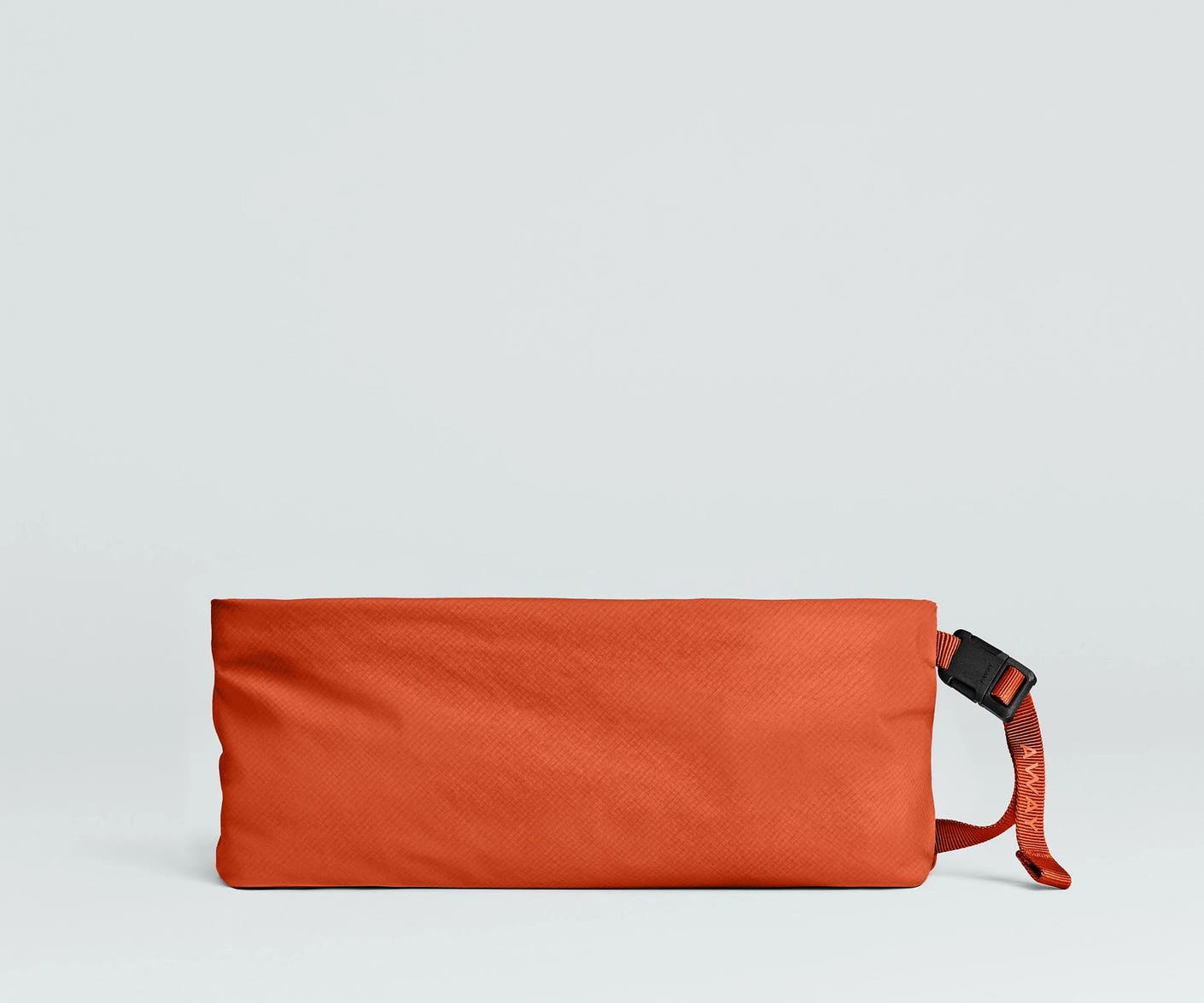 Front view of the Away For All Routes Medium Pouch in red orange