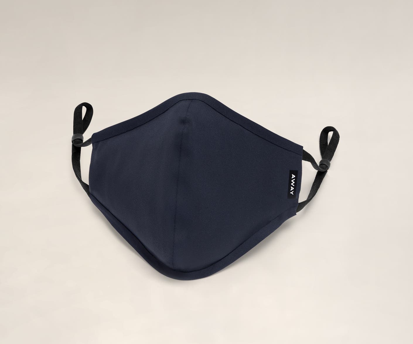 A front view of a reusable cloth face mask in navy blue.