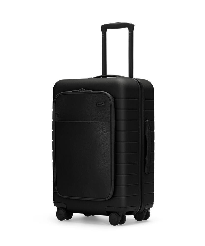 The Bigger Carry-On with Pocket in Black shown at an angle with raised telescoping handle