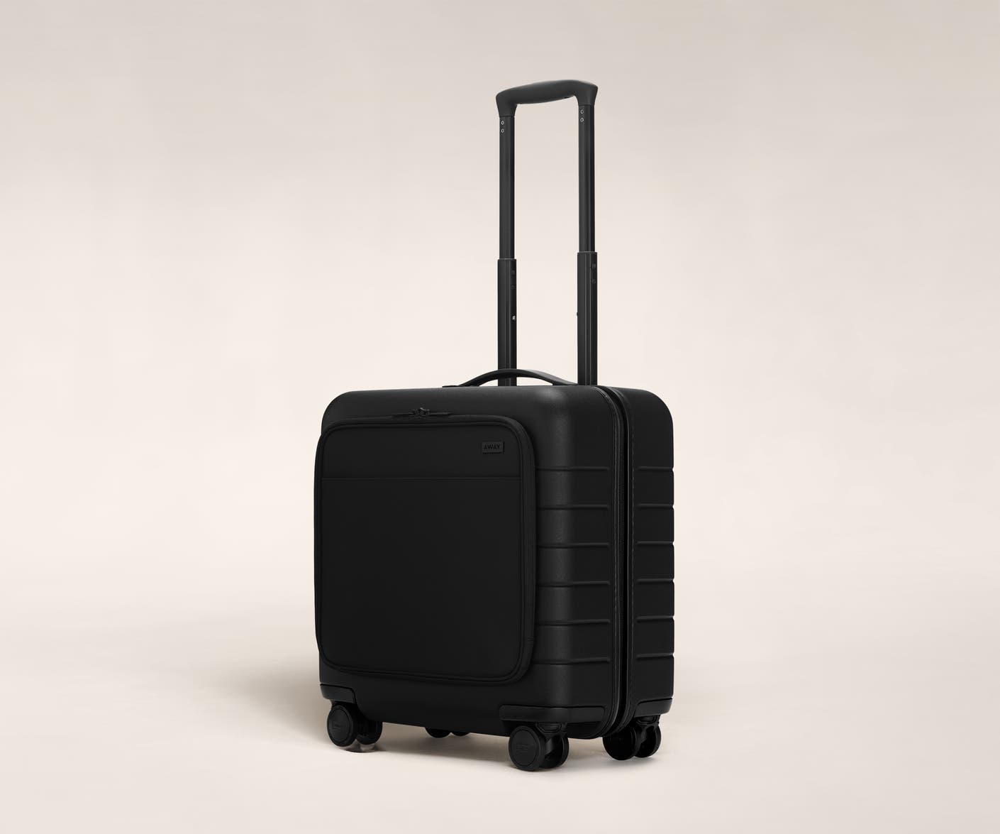 The Daily Carry-On with Pocket in Black shown at an angle with raised telescoping handle